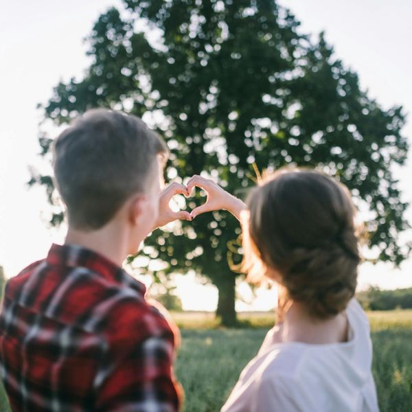 Silhouette of a man in a balanced pose against a bright background.